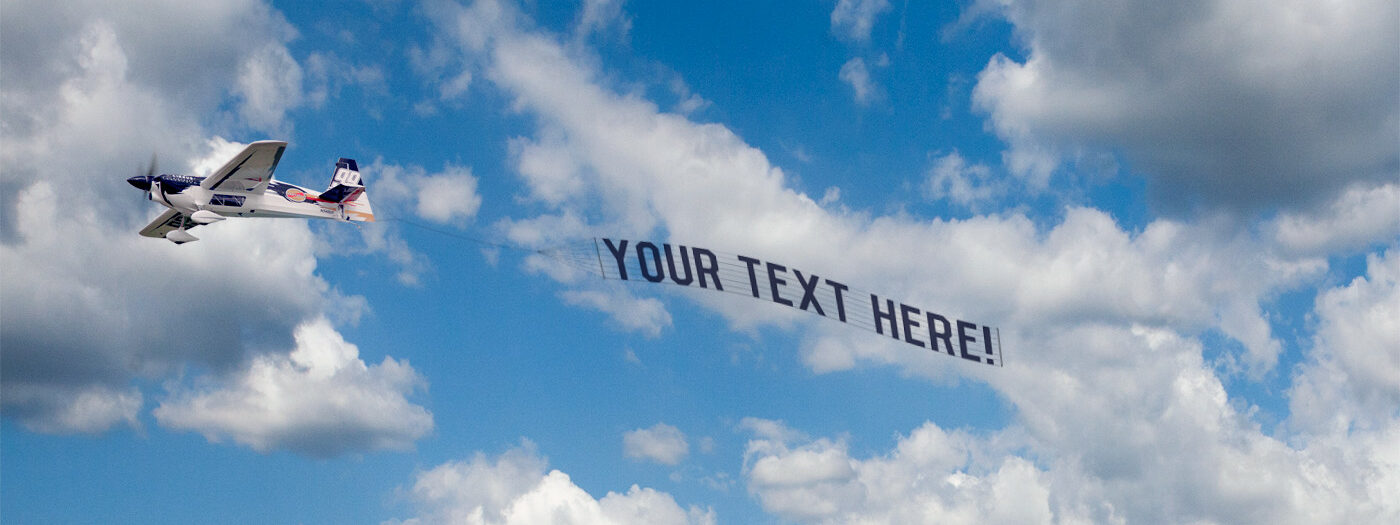 erie aerial banners flying letter banner aerial sign sky ad